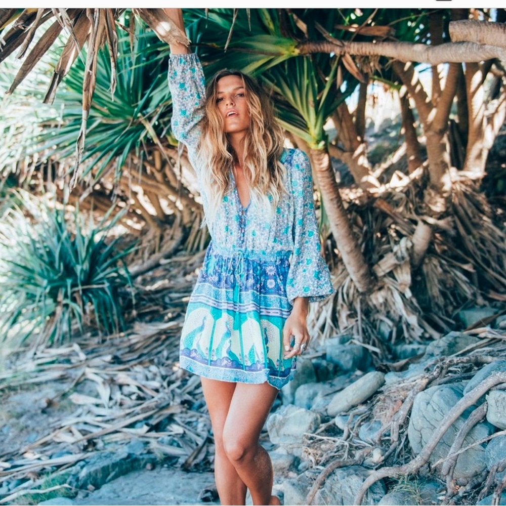 Spell and the Gypsy blue mini sundress featuring bell sleeves and a V-neck.